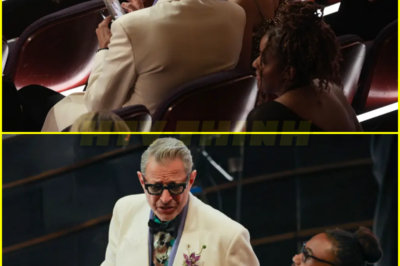 Jeff Goldblum caught checking out his Red Carpet photos while attending The Oscars