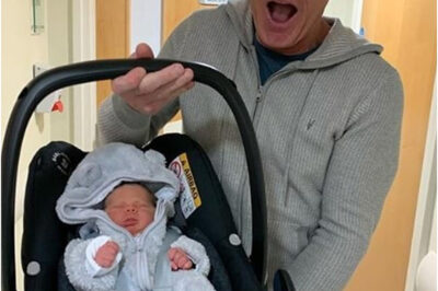 Gordon Ramsay, 52, proudly carries newborn son Oscar out of hospital before taking him on a tour of his restaurant