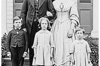 The restorers enlarged this portrait — what they found in the slave child’s hands shocked them  The restoers enlarged this portrait.  What they found in the slave child’s hands shocked them.  The conservation lab on the third floor of the National Museum of American History sat in near silence, broken only by the soft hum of specialized lighting equipment and the occasional click of a camera shutter.  David Martinez had worked as a photographic conservator for 12 years, but he still felt a flutter of anticipation each time he began restoring a piece of history that had been locked away in darkness for generations.  Today’s subject was a dgeray from 1858 donated by the estate of Louisiana family.  The image showed a well-dressed white family posed formally on the steps of what appeared to be a plantation house.  A man in a dark suit, a woman in an elaborate dress with a cameo brooch, and three children arranged in descending height order, standard for the era, unremarkable except for its age and fragile condition.  David adjusted his magnification glasses and carefully positioned the plate under the digital scanner.  The technology could capture details invisible to the naked eye, preserving every microscopic element before the silver began its inevitable decay.  As the highresolution scan progressed line by line across the image, his assistant Marcus stood behind him documenting the process.