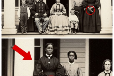 The restorers enlarged this portrait and discovered something in the slave that no one had noticed  The conservation lab at the Charleston Heritage Museum smelled of chemicals and old paper.  Sarah Williams adjusted her magnifying lamp over the dgeray type, her gloved hands steady as she positioned the 1862 photograph under the scanner.  It was her third week cataloging items from the Whitfield estate collection, and most pieces had been unremarkable, faded family portraits, property deeds, ledgers documenting cotton yields.  This particular photograph showed the Whitfield family posed on their plantation verand.  James Whitfield stood rigid in his Confederate officer’s uniform.  His wife, Catherine, seated beside him in an elaborate hoop skirt.  There are three children arranged around them like porcelain dolls.  The image quality was exceptional for the era, crisp and wellpreserved despite its age.  Sarah had processed dozens of similar portraits.  Wealthy southern families documenting their prosperity, their status, their version of history.  She began the high resolution scan, watching the progress bar creep across her screen.