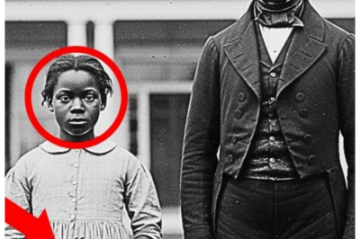 During the restoration, experts found a hidden detail in the slave girl’s clothing no one saw before  During the restoration, experts found a hidden detail in the slave girl’s clothing no one saw before.  Dr.Sarah Chen carefully positioned the dgerotype under the digital microscope, her breath shallow with concentration.  The image before her was haunting.  A young black girl, no more than 12, standing rigid beside a well-dressed white man in front of a columned mansion.  New Orleans, 1858.  The plate had arrived at the Smithsonian Conservation Lab 3 weeks ago, donated by an estate in Baton Rouge, and Sarah had been tasked with its restoration and authentication.  The dgeray type was remarkably preserved.  Its silver surface still reflecting light after 166 years.  But something about the girl’s expression unsettled Sarah.  While most enslaved people photographed in that era showed blank, emotionless faces, a defense mechanism against dehumanization, this girl’s eyes held something different.  Not defiance exactly, but intention.  Purpose.