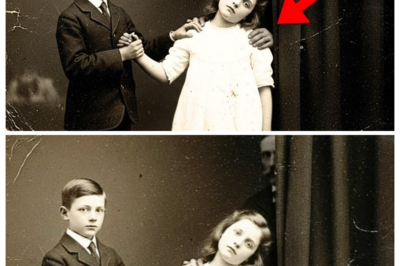 THIS 1899 PHOTO OF A BOY HOLDING HIS SISTER’S HAND LOOKED SWEET — UNTIL RESTORATION REVEALED THE WORST  A seemingly innocent 1899 photograph of a young boy holding his sister’s hand recently stunned historians and the public alike. After careful digital restoration, previously hidden details emerged, revealing a disturbing truth that completely changed the way the image is interpreted. What was once seen as a simple, heartwarming moment now raises questions about the lives, circumstances, and secrets of the past. Why restoration technology exposed this shocking reality, what experts are saying, and how it challenges our perception of history is capturing worldwide attention. CLICK THE ARTICLE LINK IN THE COMMENTS to see the full story and the astonishing revelation.